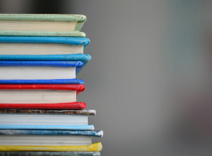 A stack of colourful books on their side